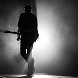 Guitarist walks to stage